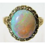A 14ct gold ring set with opal & approx. 0.6ct of