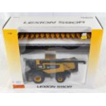 A boxed diecast CAT Lexion 590R Combine Harvester