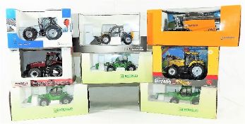 Eight boxed diecast tractors & agricultural vehicl