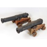 A large pair of oak mounted cannons, approx. 16in