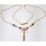 An early 20thC. 9ct gold necklace set with amethys