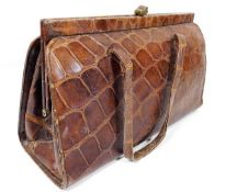 A ladies early/mid 20thC. crocodile skin handbag