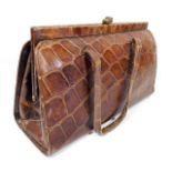 A ladies early/mid 20thC. crocodile skin handbag