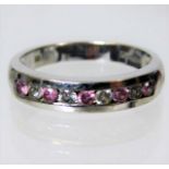 A 9ct white gold ring set with pink & white stones