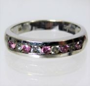 A 9ct white gold ring set with pink & white stones