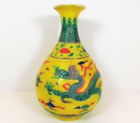 A Chinese porcelain baluster vase with dragon chas