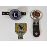 Three vintage motoring badges