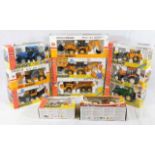 Ten boxed JCB, Caterpillar & similar diecast tract