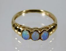 A 9ct gold ring set with three opals 1.6g size J