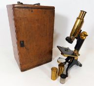 A 19thC. brass microscope by Baker of London with