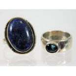 A white metal lapis lazuli ring twinned with one o