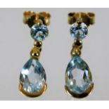 A pair of 9ct gold drop earrings set with topaz 3.