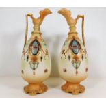 A pair of early 20thC. decorative blush ivory ewer