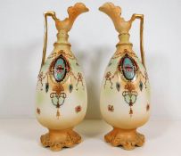 A pair of early 20thC. decorative blush ivory ewer