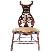 A 19thC. mahogany music chair, repair to splat 37.