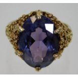 A 9ct gold gypsy style ring set with alexandrite style stone 7.3g, size P.