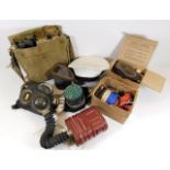 A collection of wartime gas masks & related items