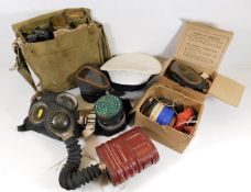 A collection of wartime gas masks & related items