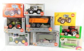 Nine boxed Siku diecast tractors & agricultural ve