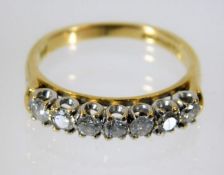 An 18ct gold ring set with seven diamonds of 0.5ct