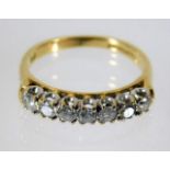 An 18ct gold ring set with seven diamonds of 0.5ct