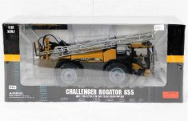 A boxed diecast Caterpillar Challenger RoGator 655