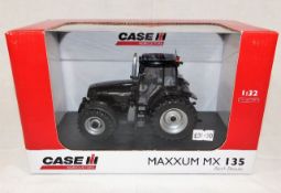 A Universal Hobbies boxed Case Maxxum MX 125 dieca
