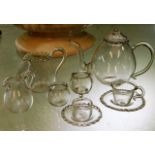 A miniature glass dolls house tea set