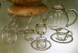 A miniature glass dolls house tea set