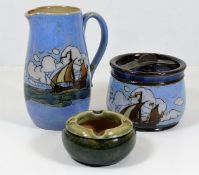 A Doulton stoneware jug & tobacco jar with sailshi