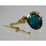 A 9ct gold black opal collar stud with plated back