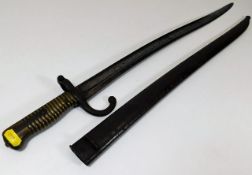 A 19thC. brass handled French bayonet with scabbar