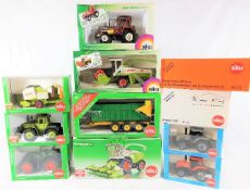 Sixteen boxed Siku diecast tractors & agricultural
