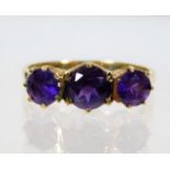 A 9ct gold amethyst trilogy ring 2.4g size O