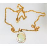 An 18in 22ct gold chain with an 18ct gold mounted opal & diamond pendant, opal size 16mm x 12mm 8.9g