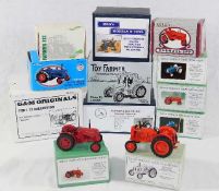 Twelve bespoke boxed model tractors & agricultural