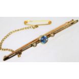 A 15ct gold bar brooch set with pearl & cornflower
