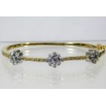 A 14ct gold bangle set with diamonds 22.5g