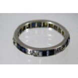 A white metal diamond & sapphire band 3g