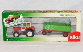 A boxed Siku diecast Massey Ferguson MF3050 tracto