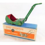 A boxed Dinky 751 lawn mower