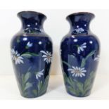 A pair of Lovatts vases with daisy decor 8in tall