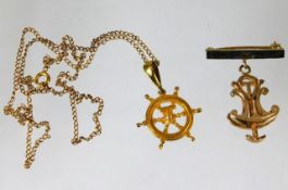 Of marine interest, a 9ct gold chain & yacht wheel