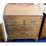 An 18thC. oak bureau with brass fittings 32 in wid