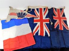 Four naval flags & ensigns, largest 35in x 16.5in