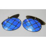 A pair of silver enamelled cufflinks