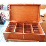 A large mahogany box with partitions