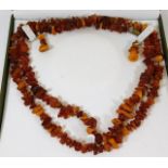 Two early 20thC. amber necklaces with amber earrin