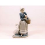 A Lladro figure of woman with geese, woman missing