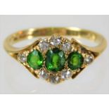 An antique 18ct gold ring set with peridot & diamond 3.5g size P (please note vendor has entered rin